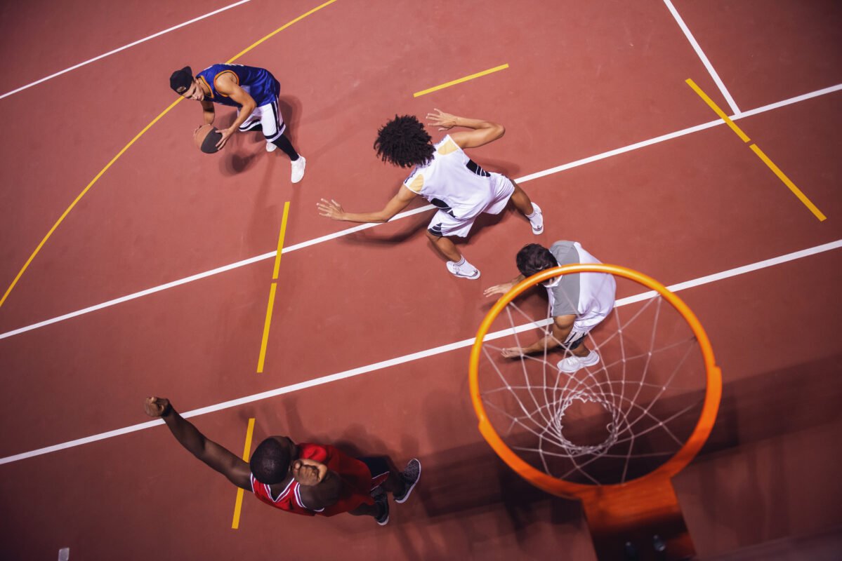 Guys playing basketball